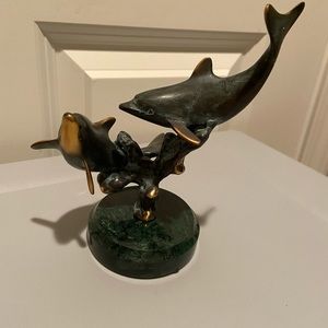 Double diving dolphin statue